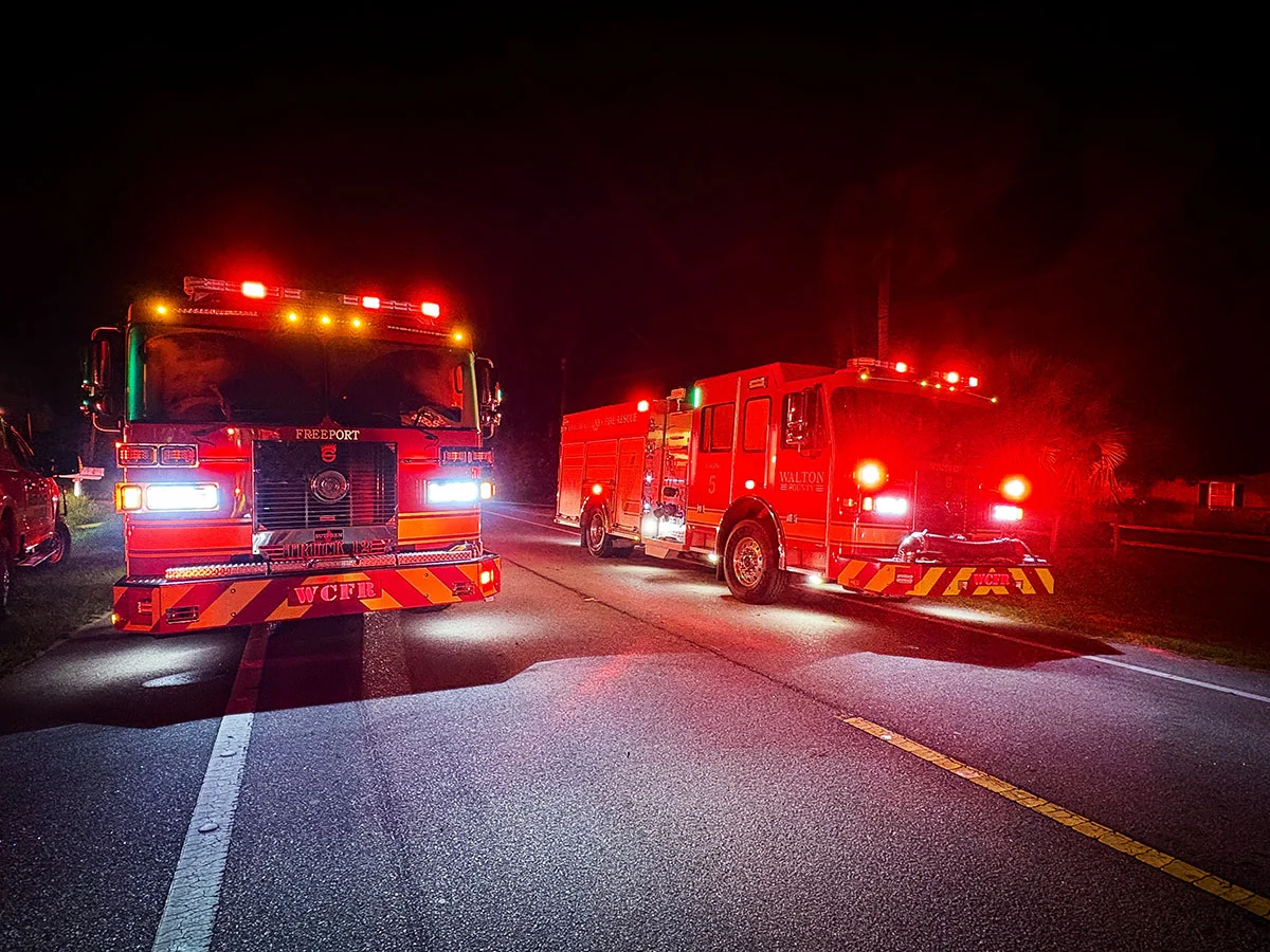 WCFR fire engines from the Freeport station blocking Highway 20 West at night with emergency lights active